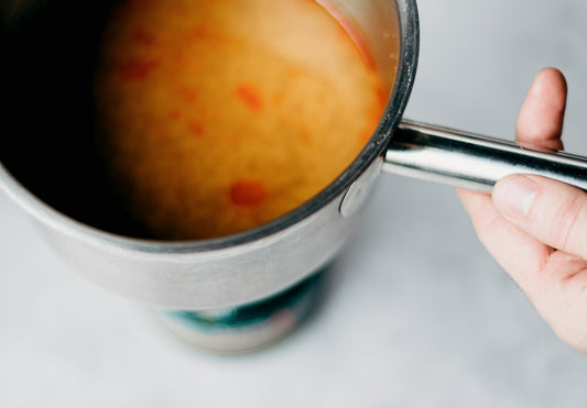 Image of cooking soup in a steel stock pot