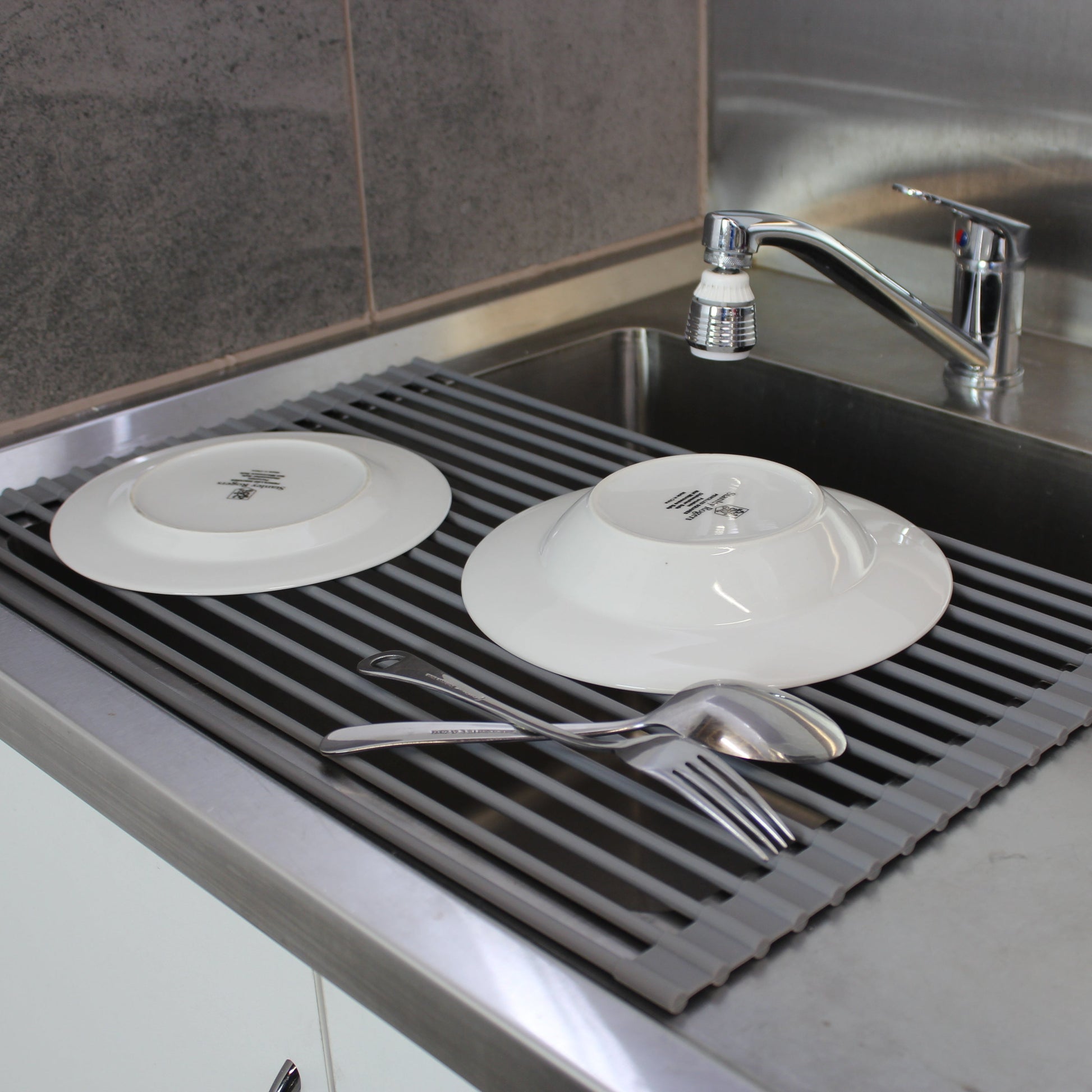 Dishes Stacked on the White Magic Drying Rack & Trivet